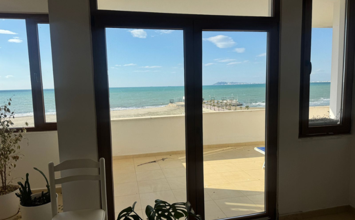 “Sea view from Qerret apartment balcony” “Spacious living room in Qerret apartment for sale”