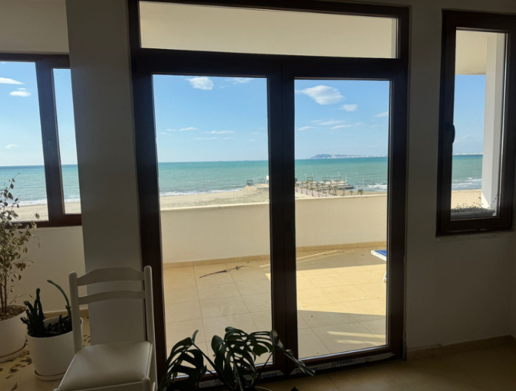 “Sea view from Qerret apartment balcony” “Spacious living room in Qerret apartment for sale”