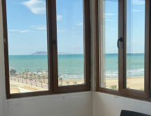 “Sea view from Qerret apartment balcony” “Spacious living room in Qerret apartment for sale”