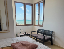 “Sea view from Qerret apartment balcony” “Spacious living room in Qerret apartment for sale”