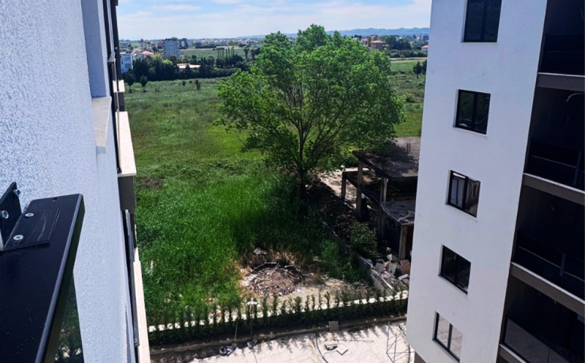 Modern apartment in new residential building, 5th floor, shared swimming pool in courtyard, Albania development, under construction