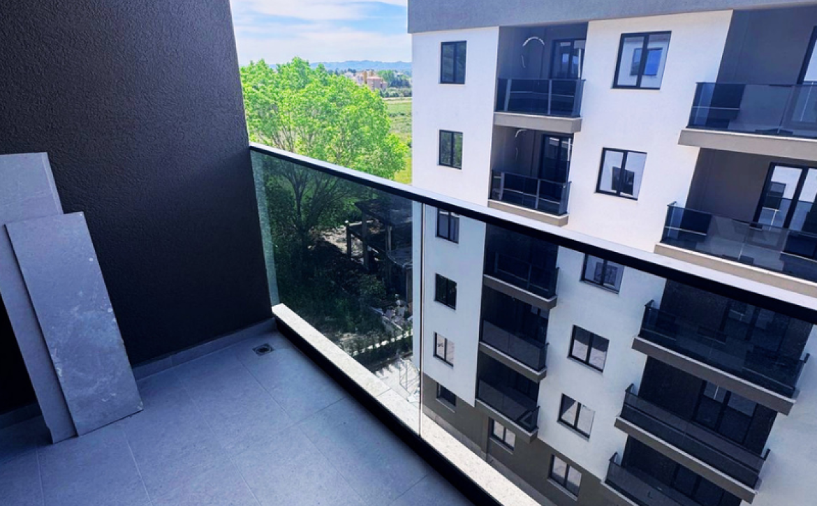 Modern apartment in new residential building, 5th floor, shared swimming pool in courtyard, Albania development, under construction