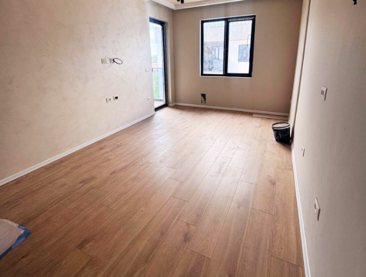 Modern apartment in new residential building, 5th floor, shared swimming pool in courtyard, Albania development, under construction