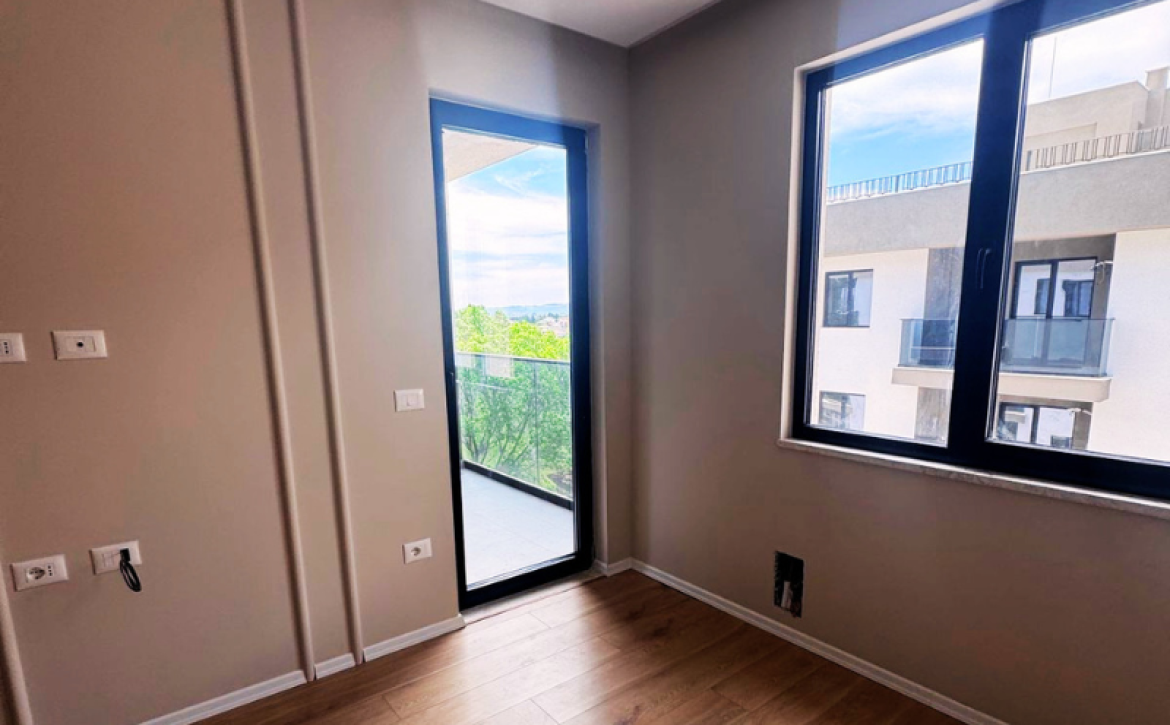 Modern apartment in new residential building, 5th floor, shared swimming pool in courtyard, Albania development, under construction