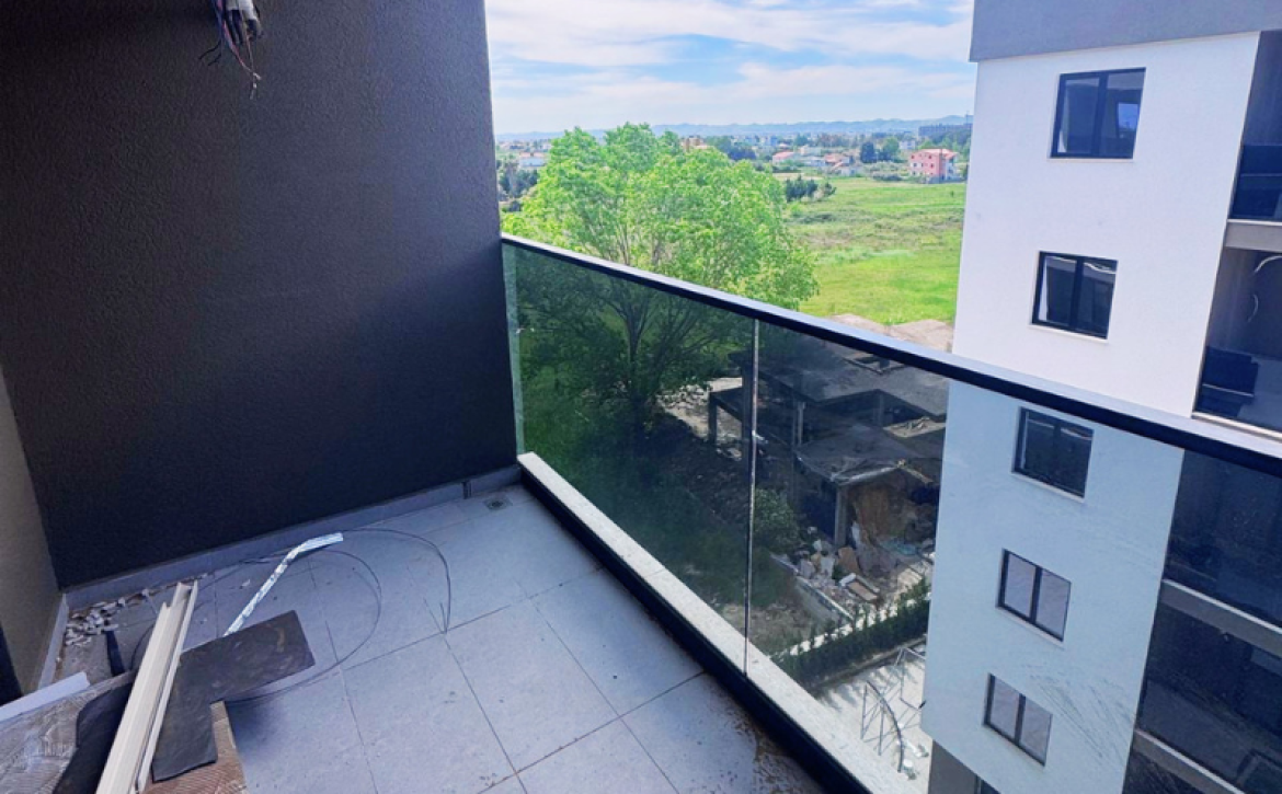 Modern apartment in new residential building, 5th floor, shared swimming pool in courtyard, Albania development, under construction