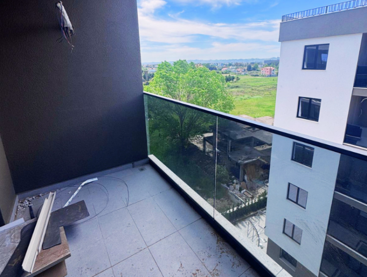 Modern apartment in new residential building, 5th floor, shared swimming pool in courtyard, Albania development, under construction