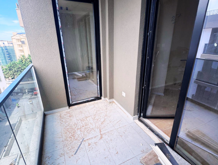 Modern apartment in new residential building, 5th floor, shared swimming pool in courtyard, Albania development, under construction